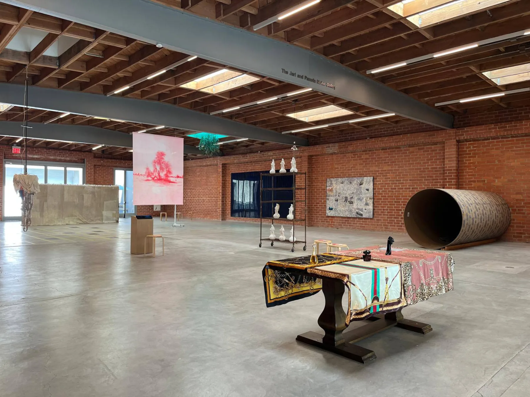 A full view of the Jarl and Pamela Mohn Gallery with the sonotube installation in the corner.