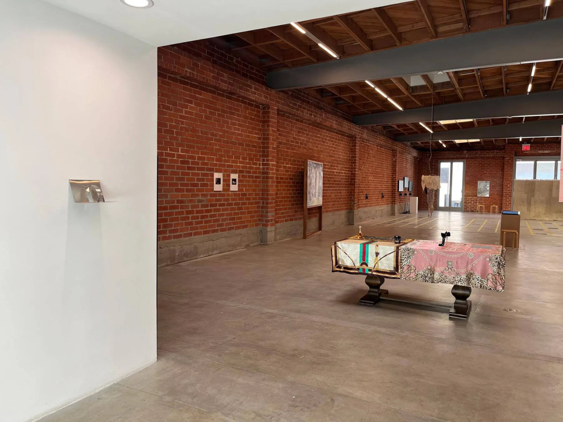 The wider gallery space at The Brick, with the installation and neighboring works.