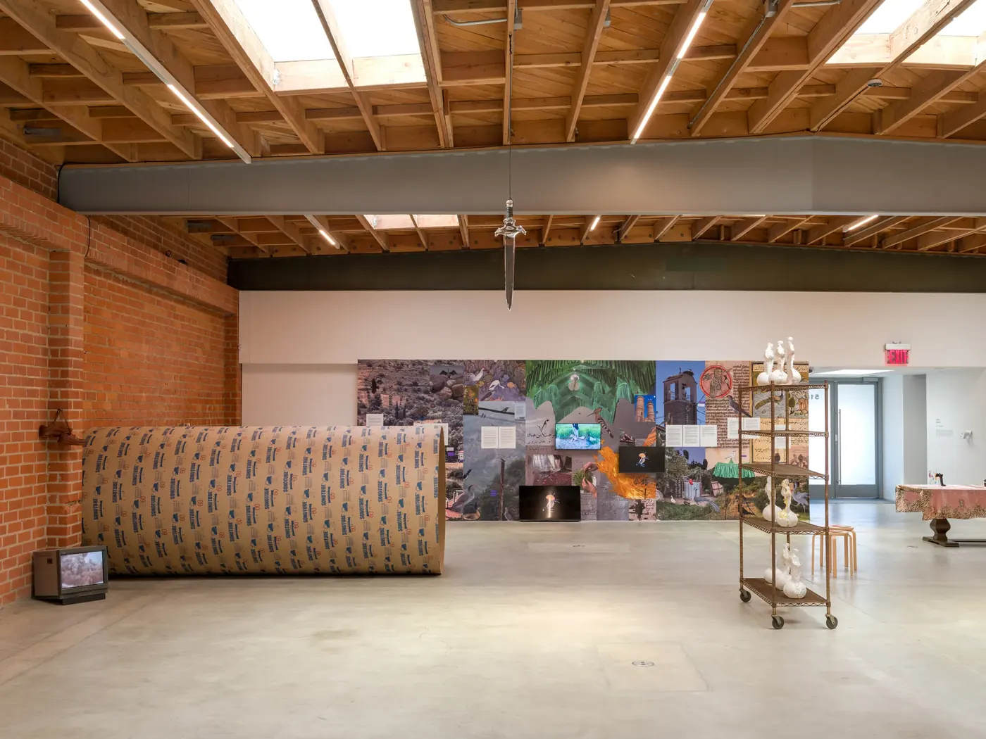 The horizontal sonotube installation, seen across the gallery at The Brick.